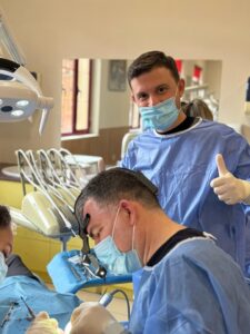 Dental team performing impacted canine extraction at Tirana Dental Center